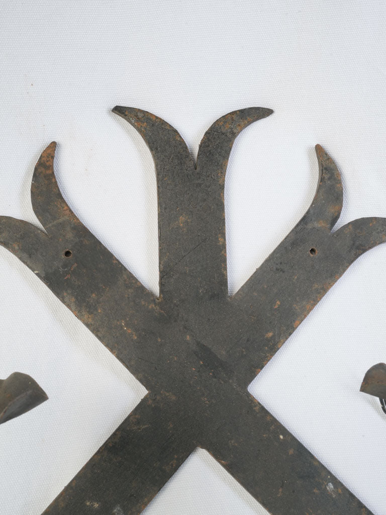 Elegant flaring crest iron sconces