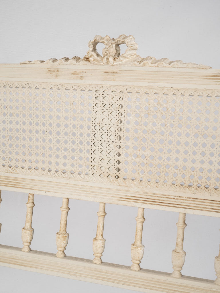 Antique French-style caned settee