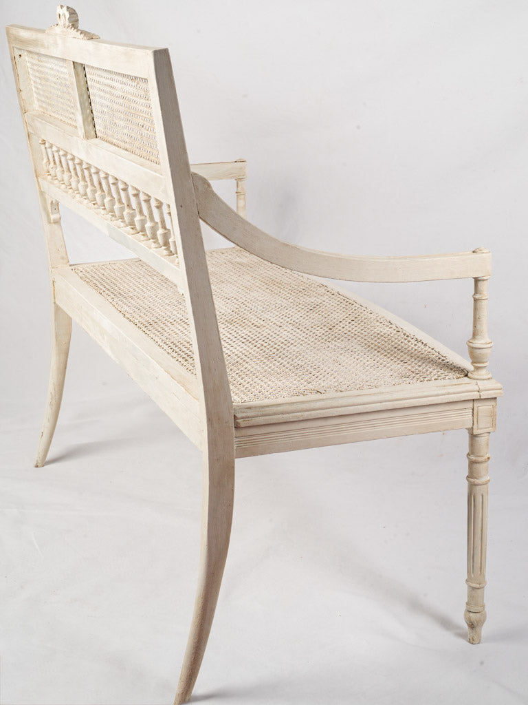 Timeless patinated caned bench