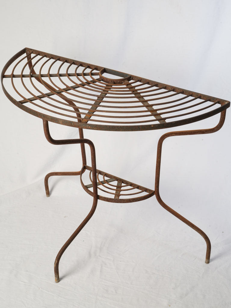 Sculptural half-moon plant stand