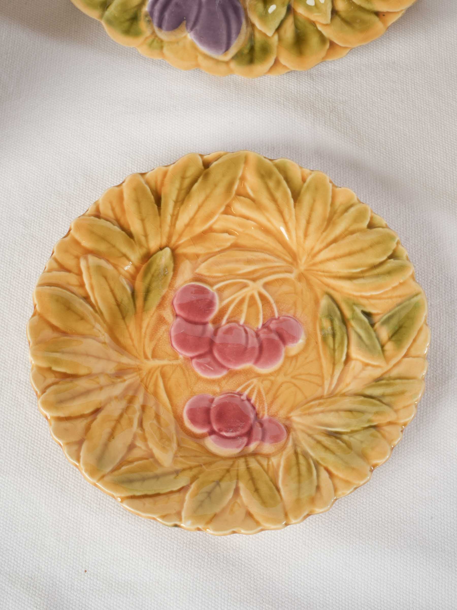 Orchard-themed yellow relief plates