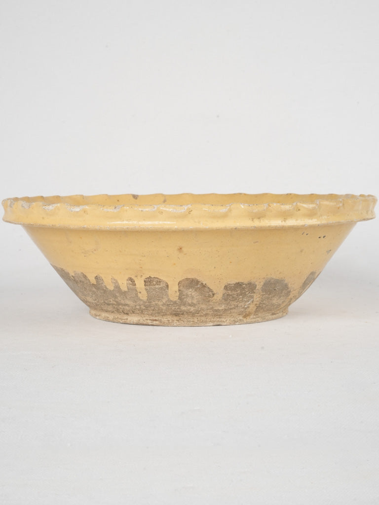 Antique yellow-glazed French salad bowl