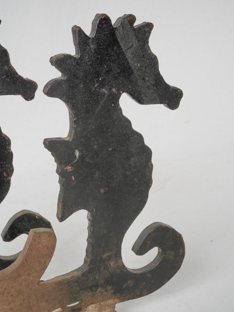 Intricate wrought iron seahorse andirons
