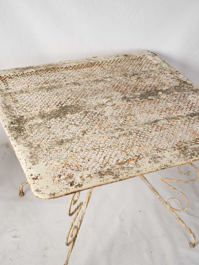 French scrolled iron outdoor chairs