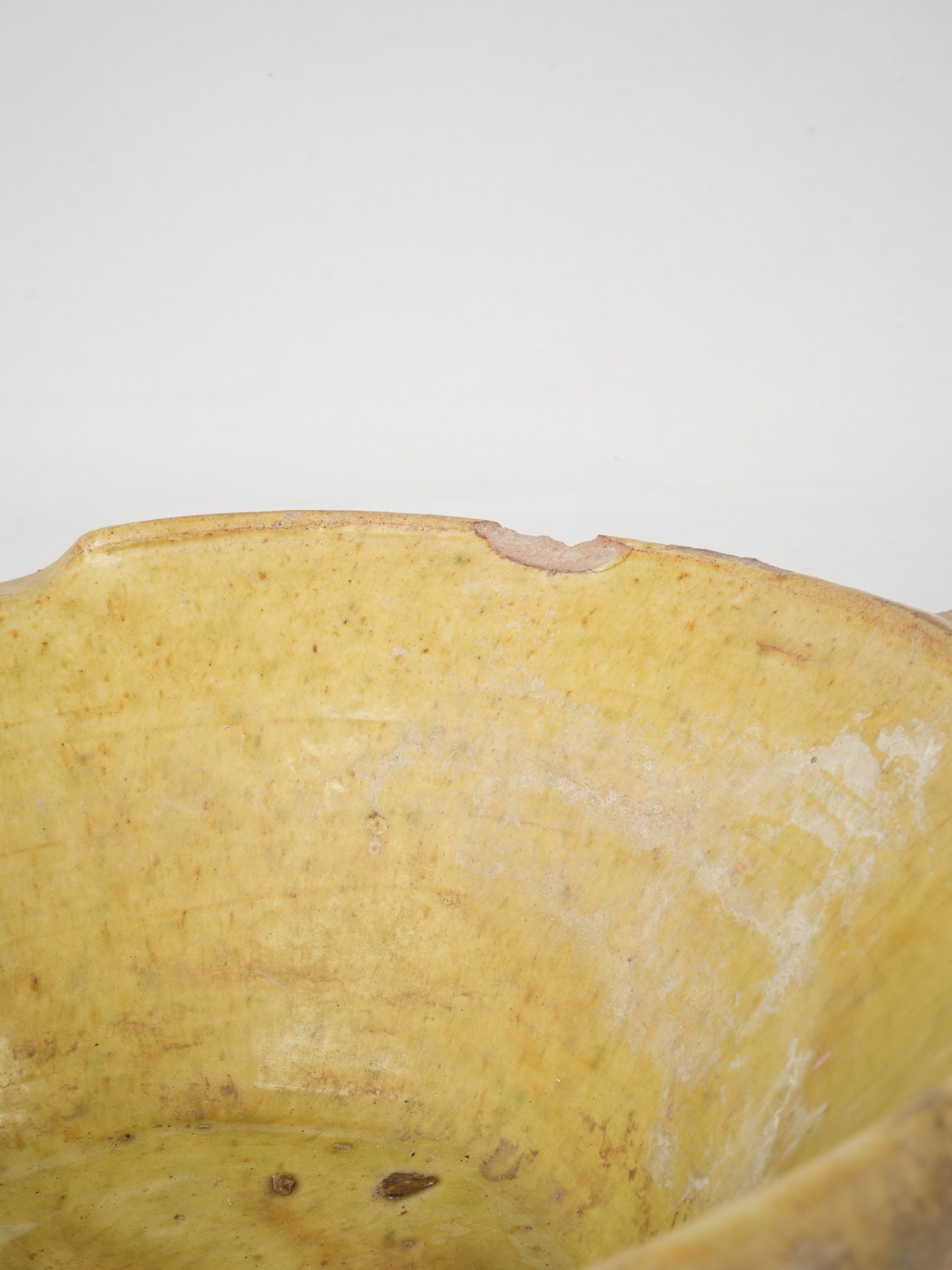 Handled yellow glazed plate