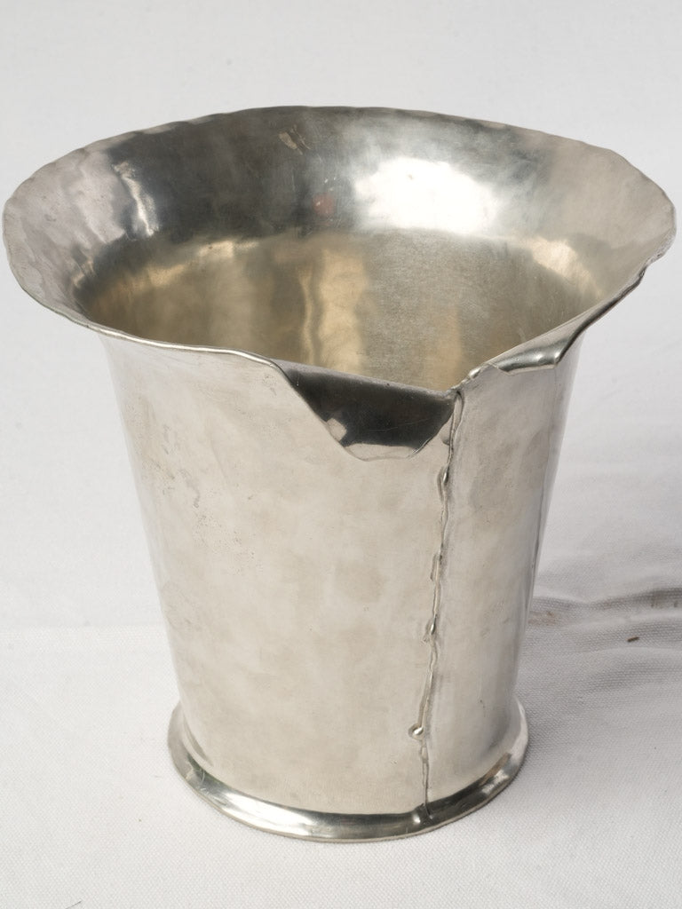 Distinctive hand-wrought pewter vessel