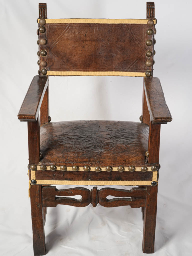 Rich aged leather upholstery armchair