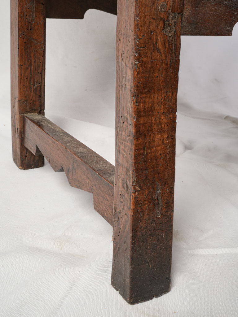 Bold dark-stained wood armchair