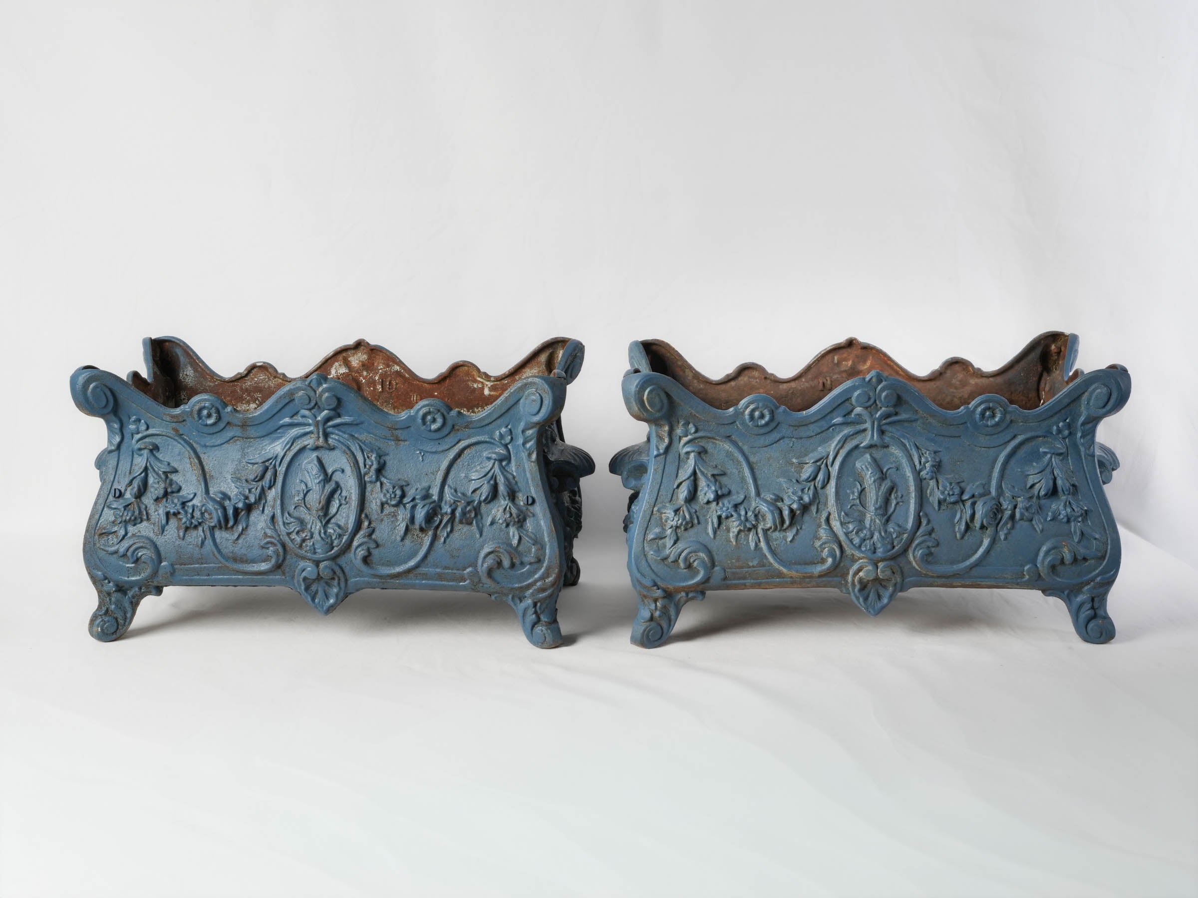 Artfully undulating rim iron planters