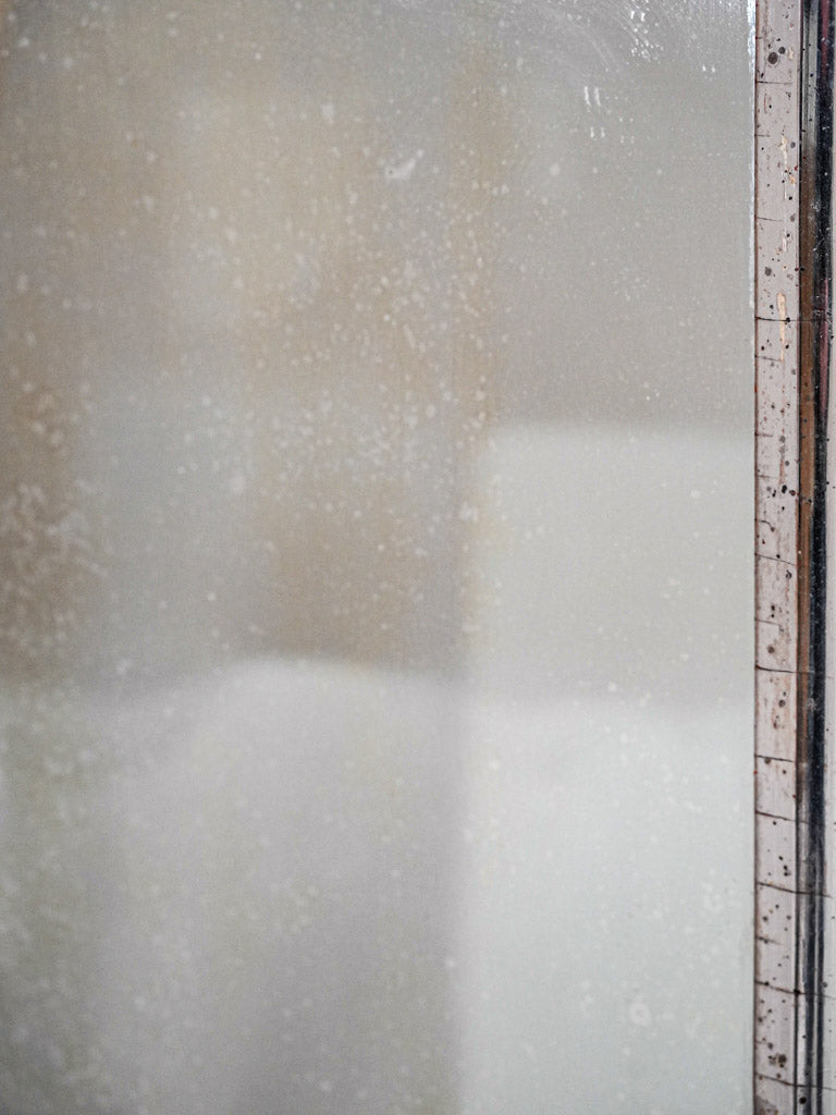 Subtle floral motif mirror