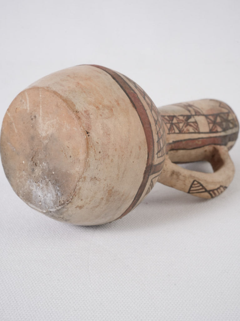 Traditional artisan painted ceramic pitcher