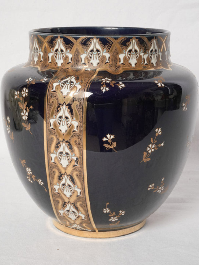 Ornate enameled French faience vase.