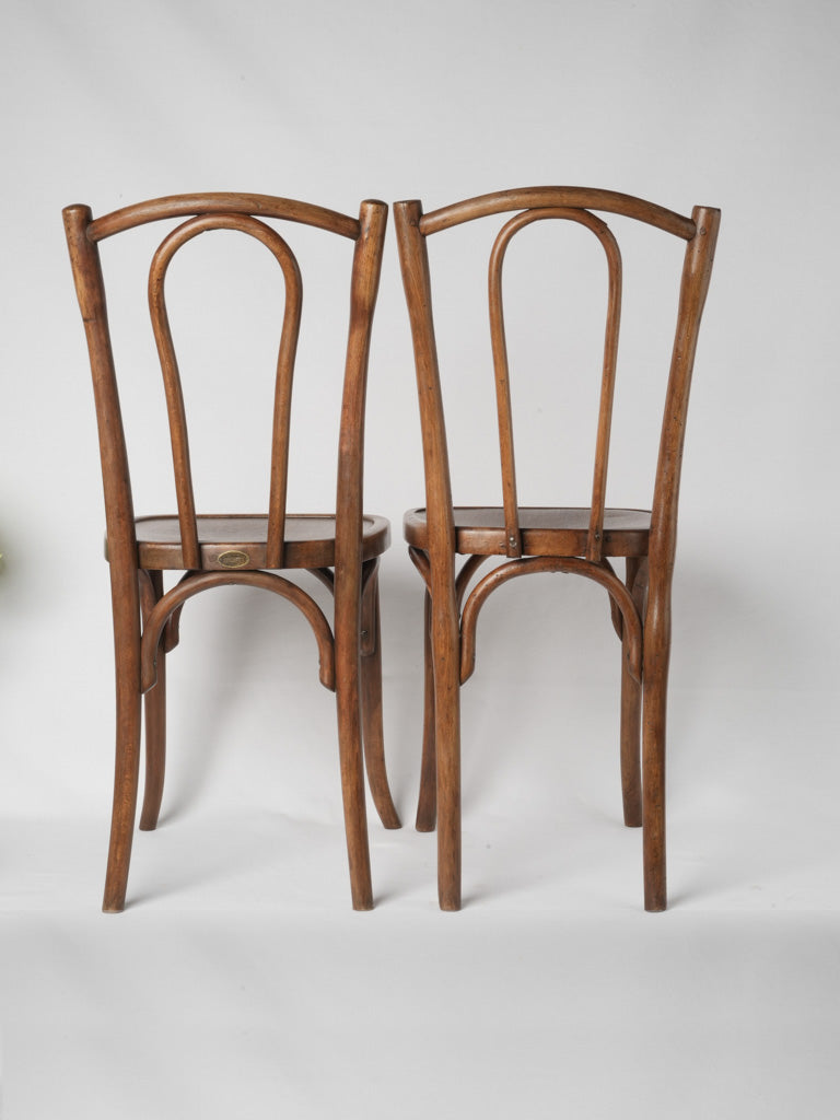 Charming age-worn wooden bistro chairs