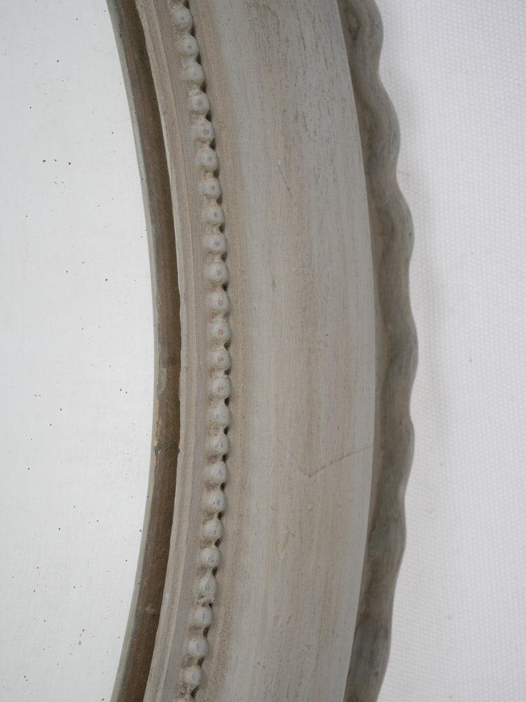 Grey-finished, antique French oval mirror