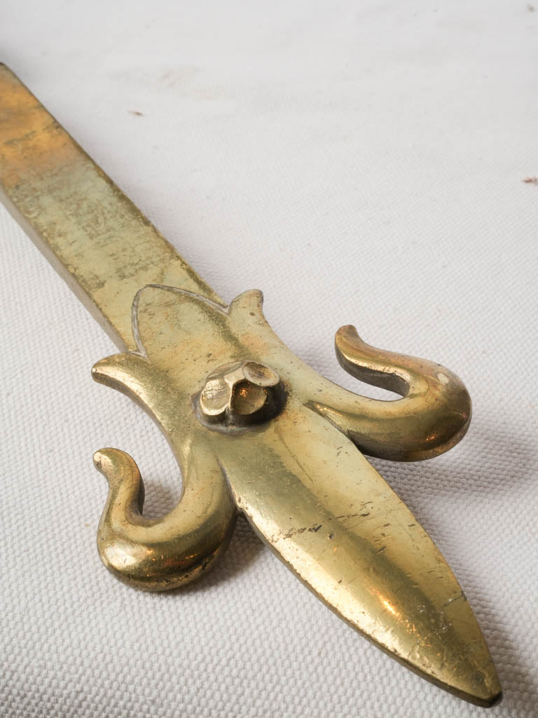 Bold patinaed gilt fireplace elements
