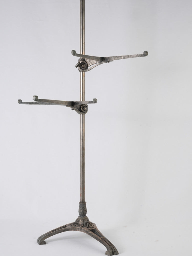 Adjustable nickel-colored metal floor stand