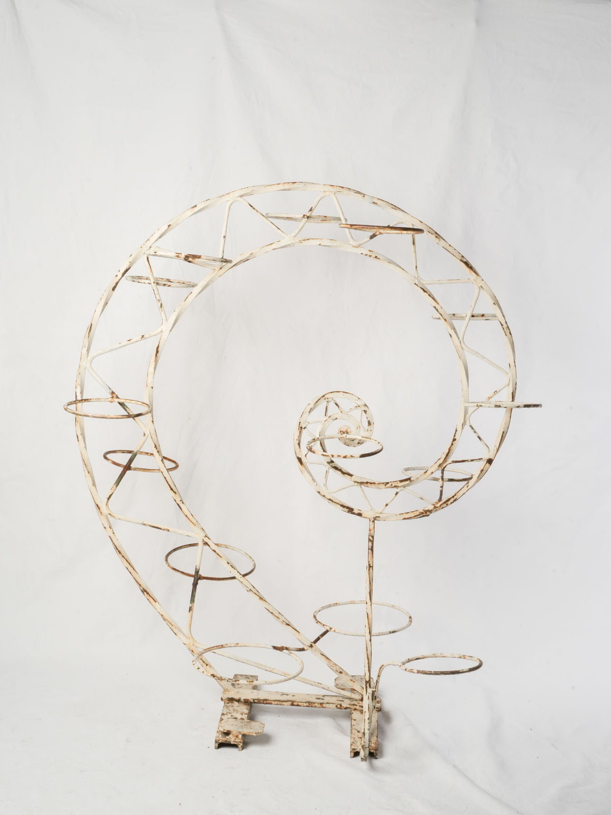 Weathered off-white spiral stands