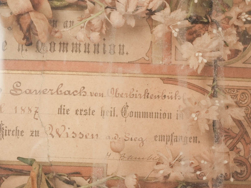 Time-honored framed floral communion certificate
