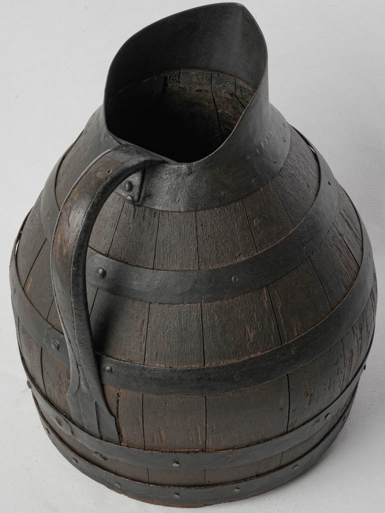 Dark-patinated wooden collectible pitcher