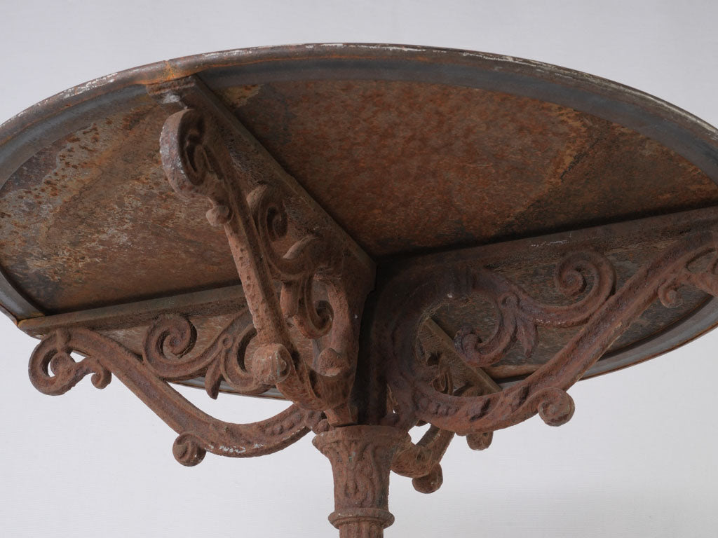Aged, weathered metal cafe table