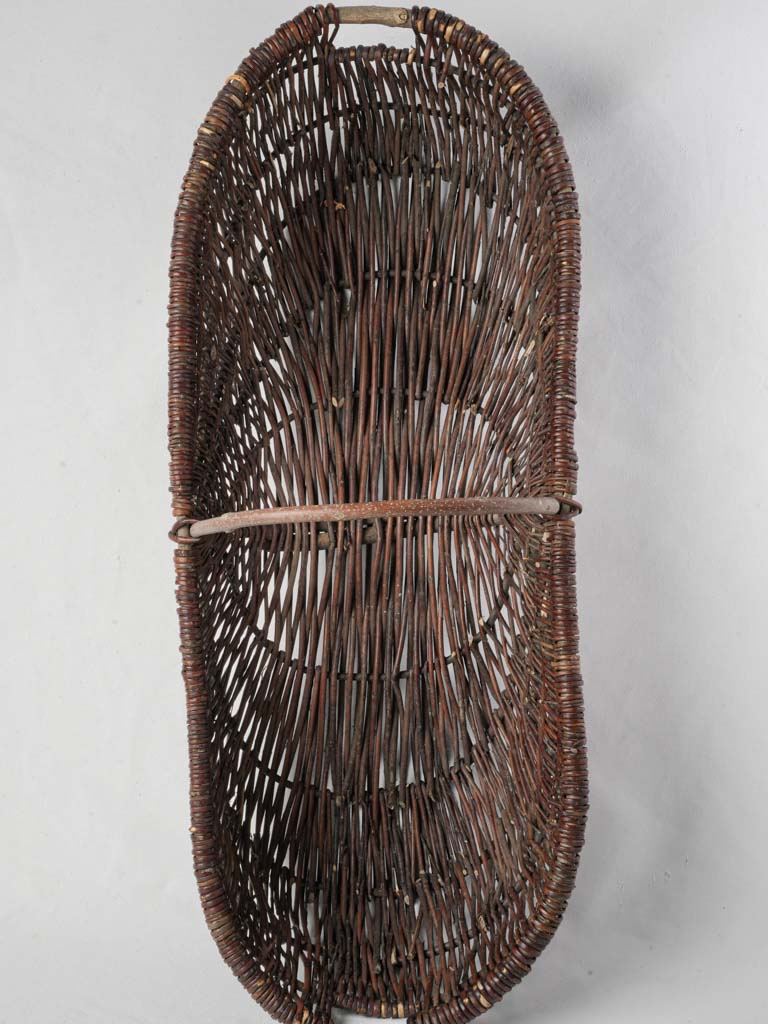 Elongated handcrafted wicker basket