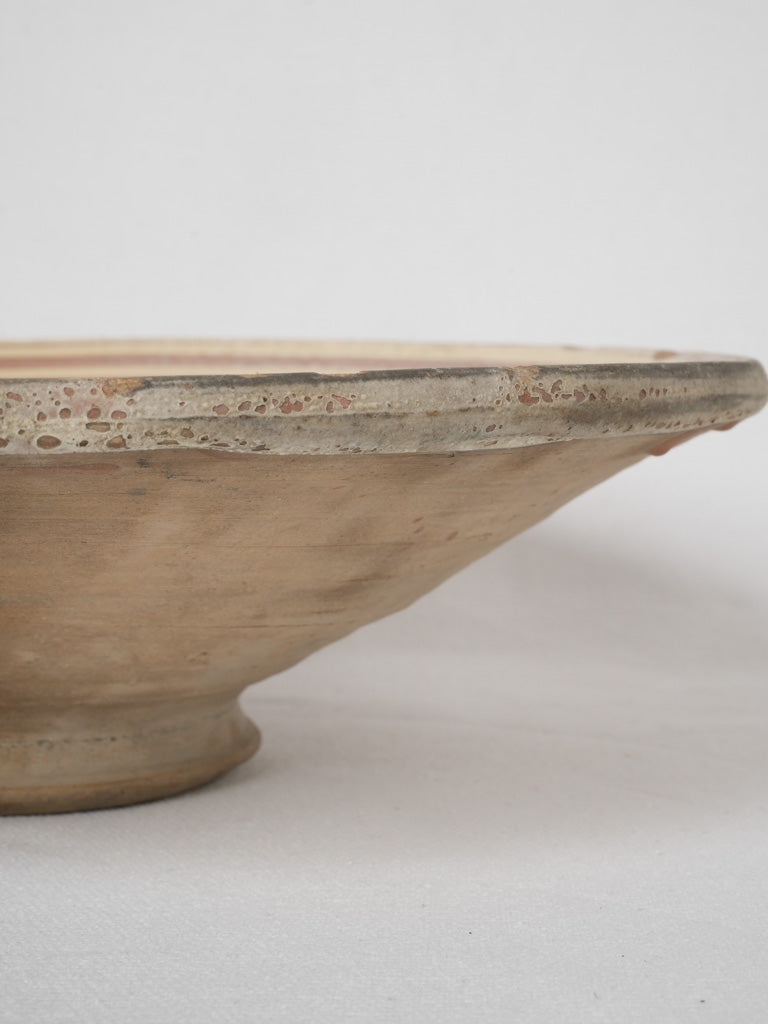 Traditional French maroon glazed terracotta dish