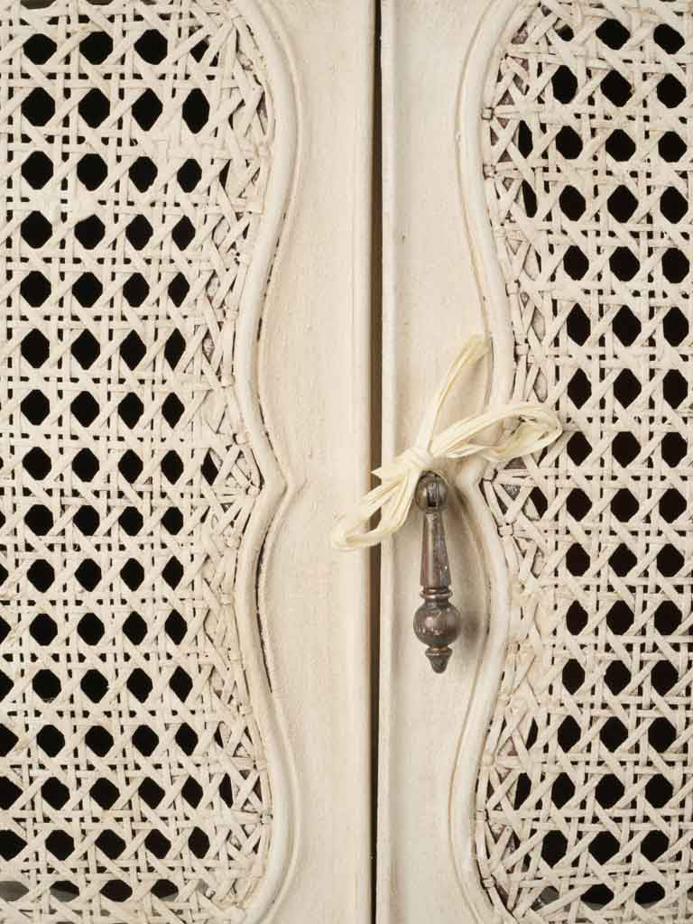 Subtly ventilated cane panel table