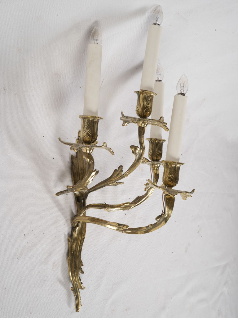 Ornate gilded bronze wall lamps