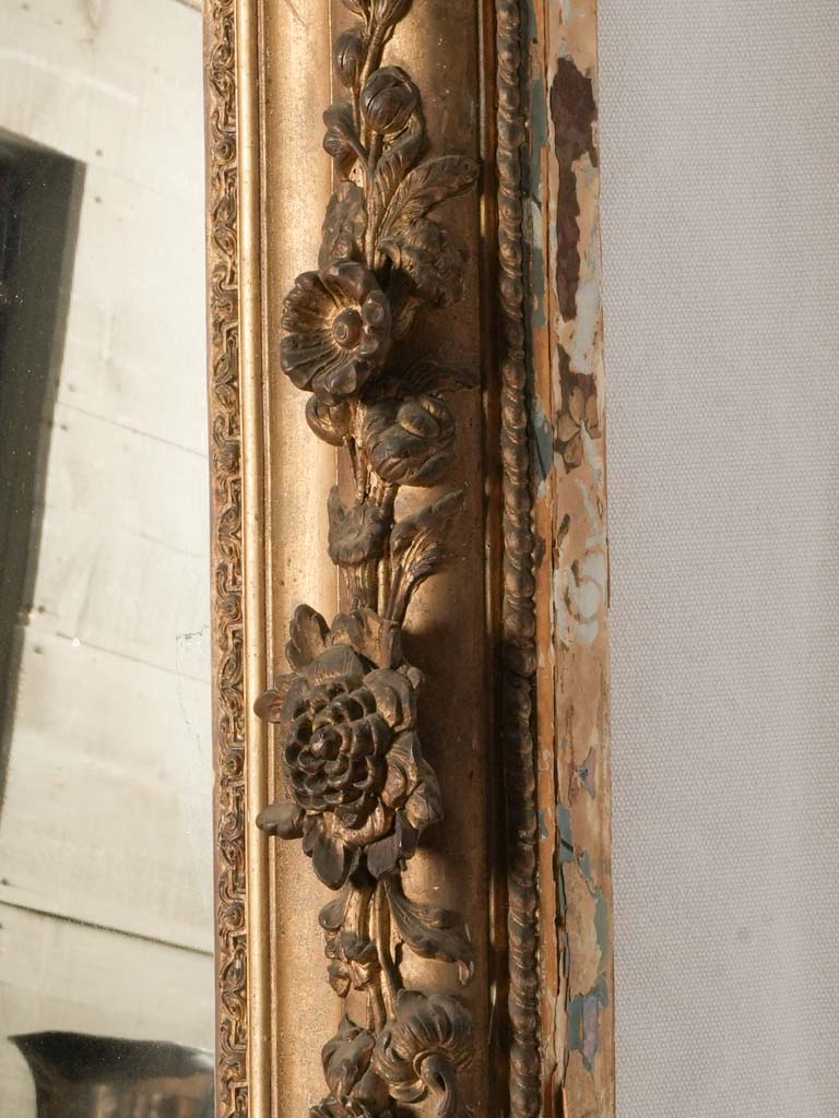 Delicate sculpted floral mirror