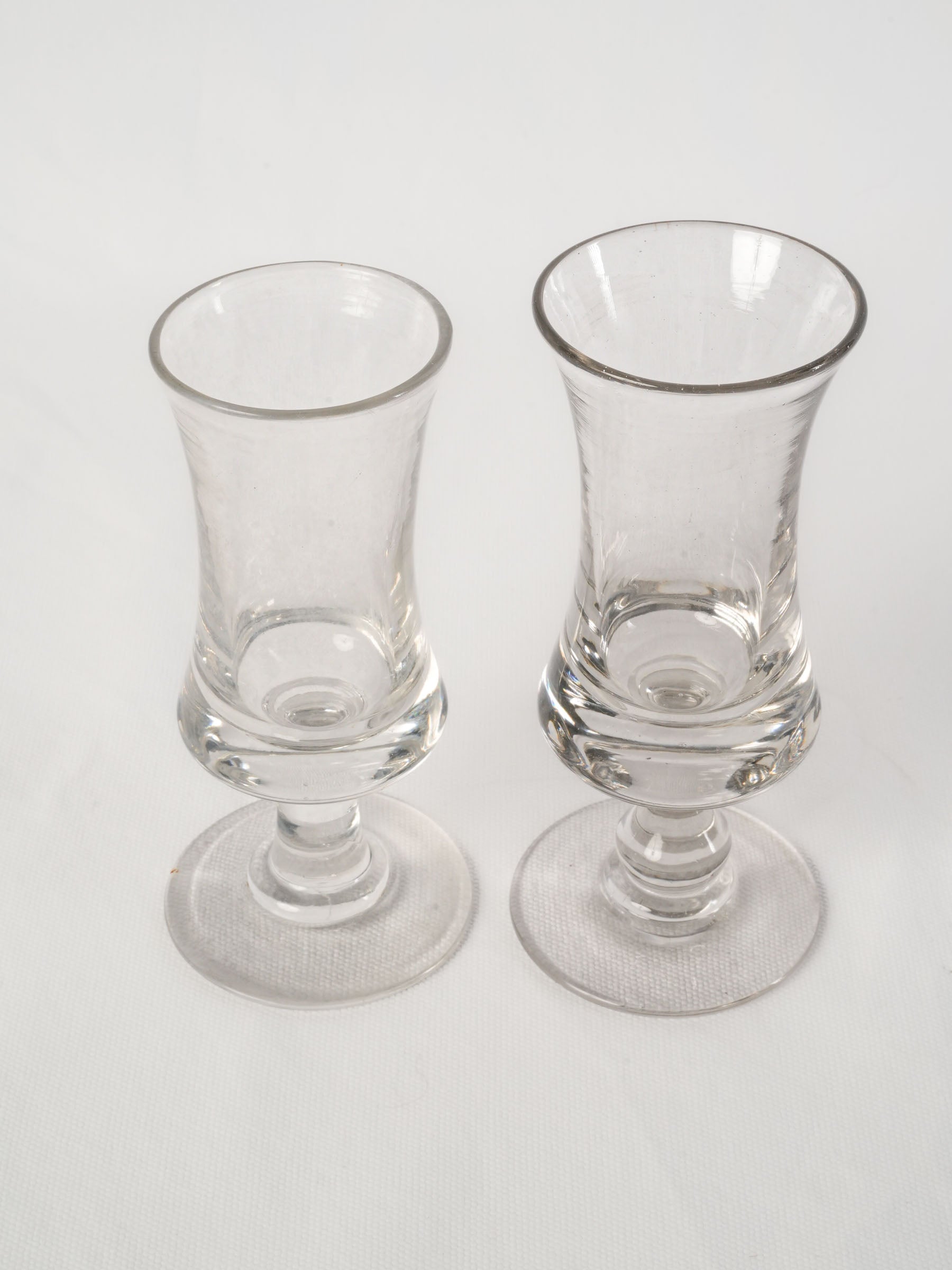 Near pair of French antique blown glass absinthe bistro glasses