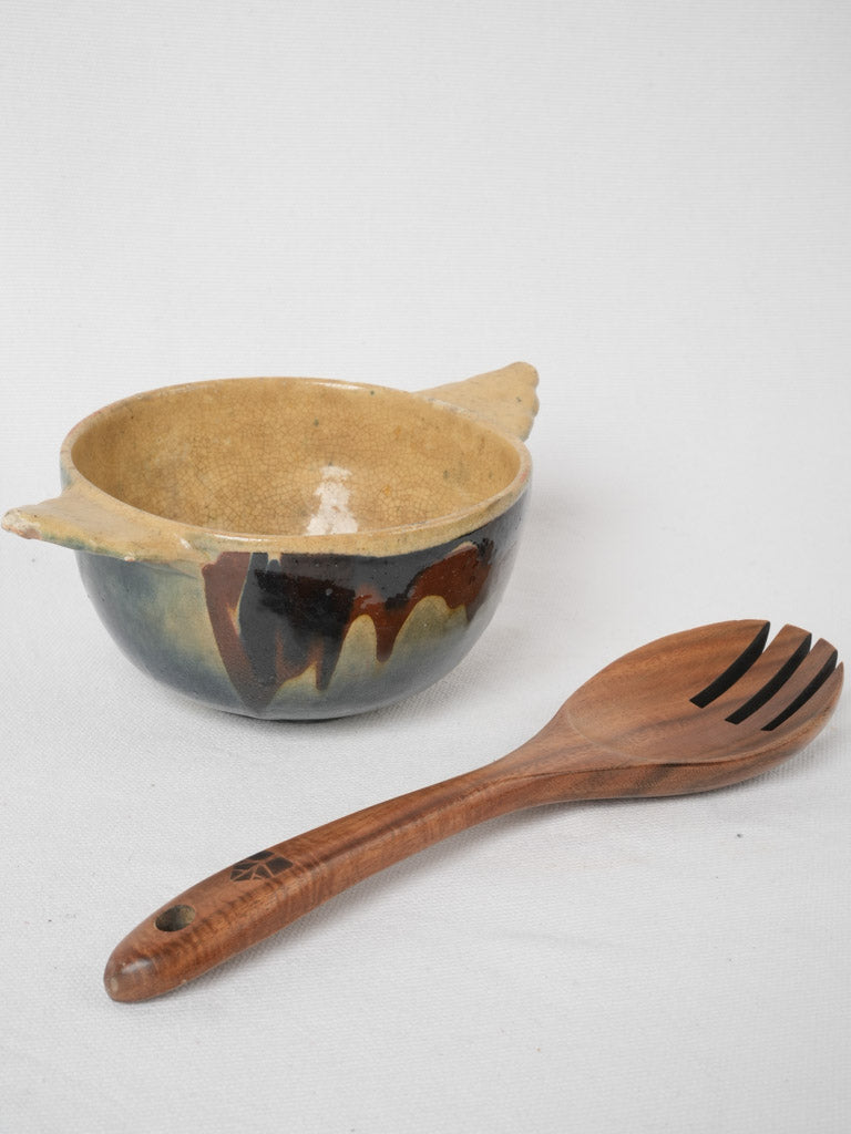 Antique two-handled yellow interior bowl
