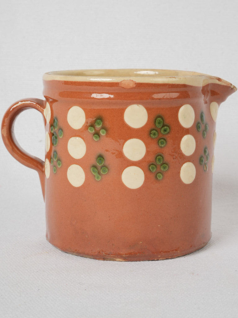 Century-old spotted ceramic creamer jug