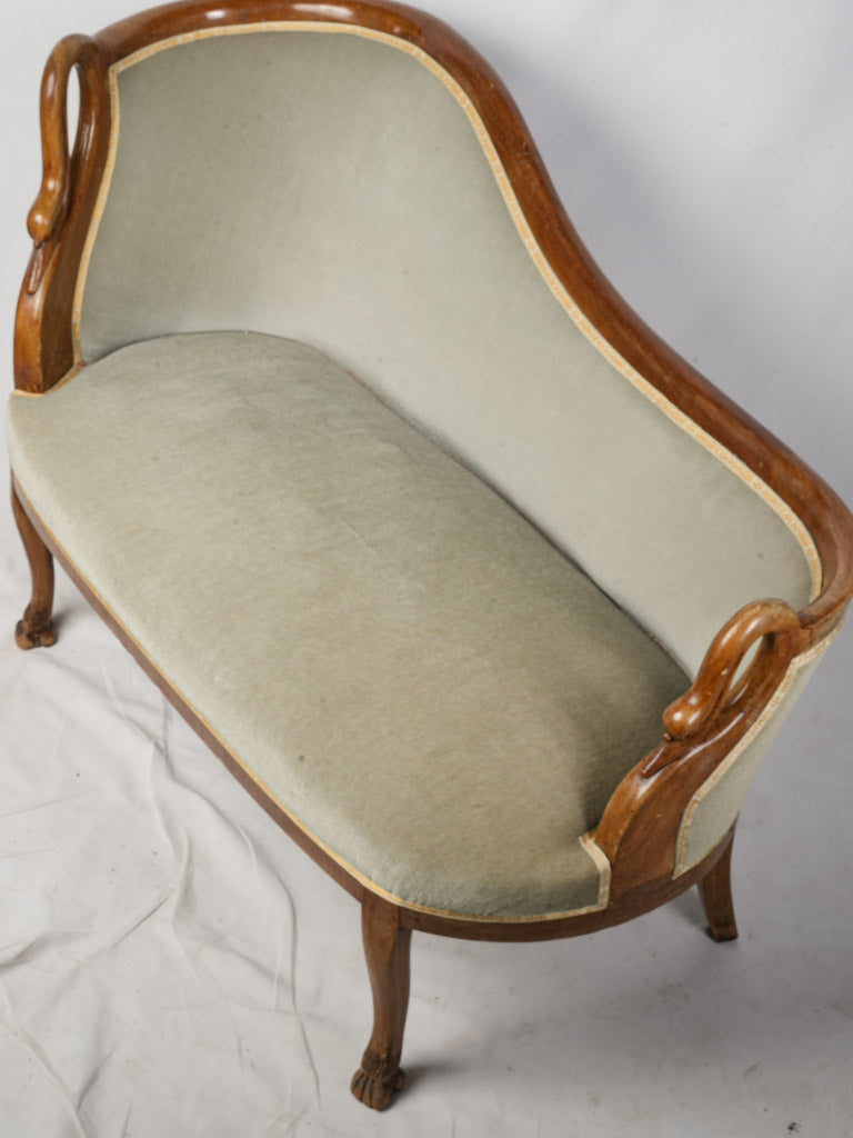 Decorative antique green upholstered banquette  