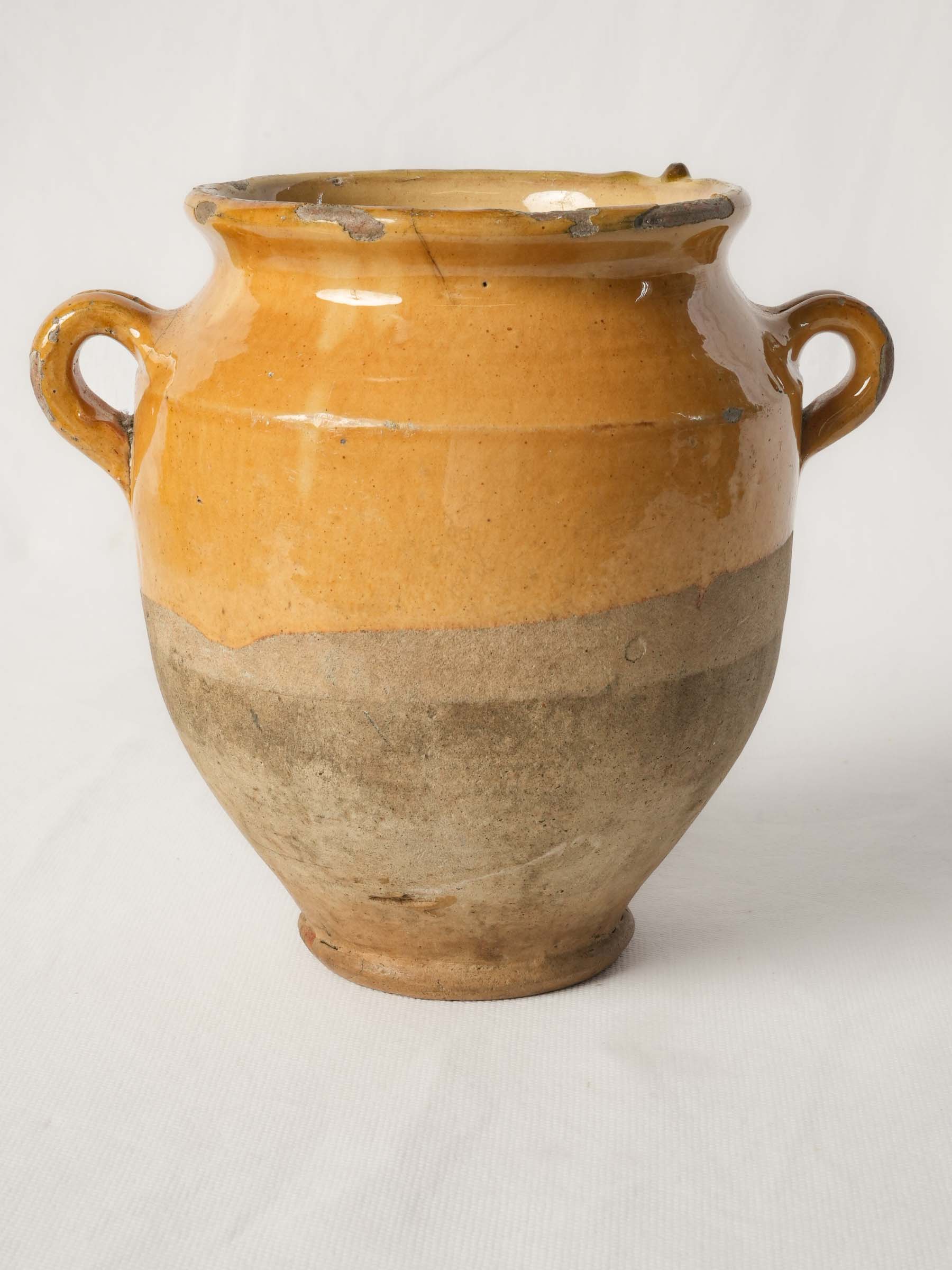 Charming ocher glazed earthenware vessel