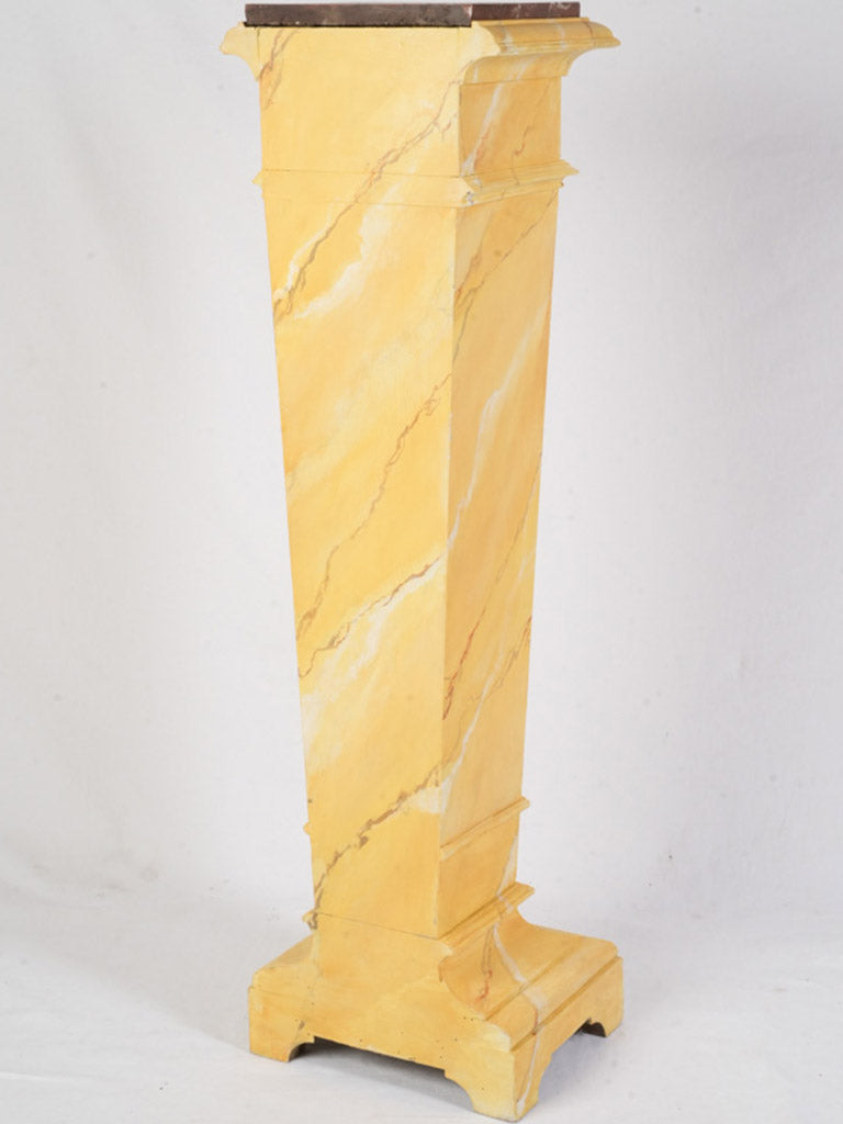Theatrical warm golden-toned pedestal