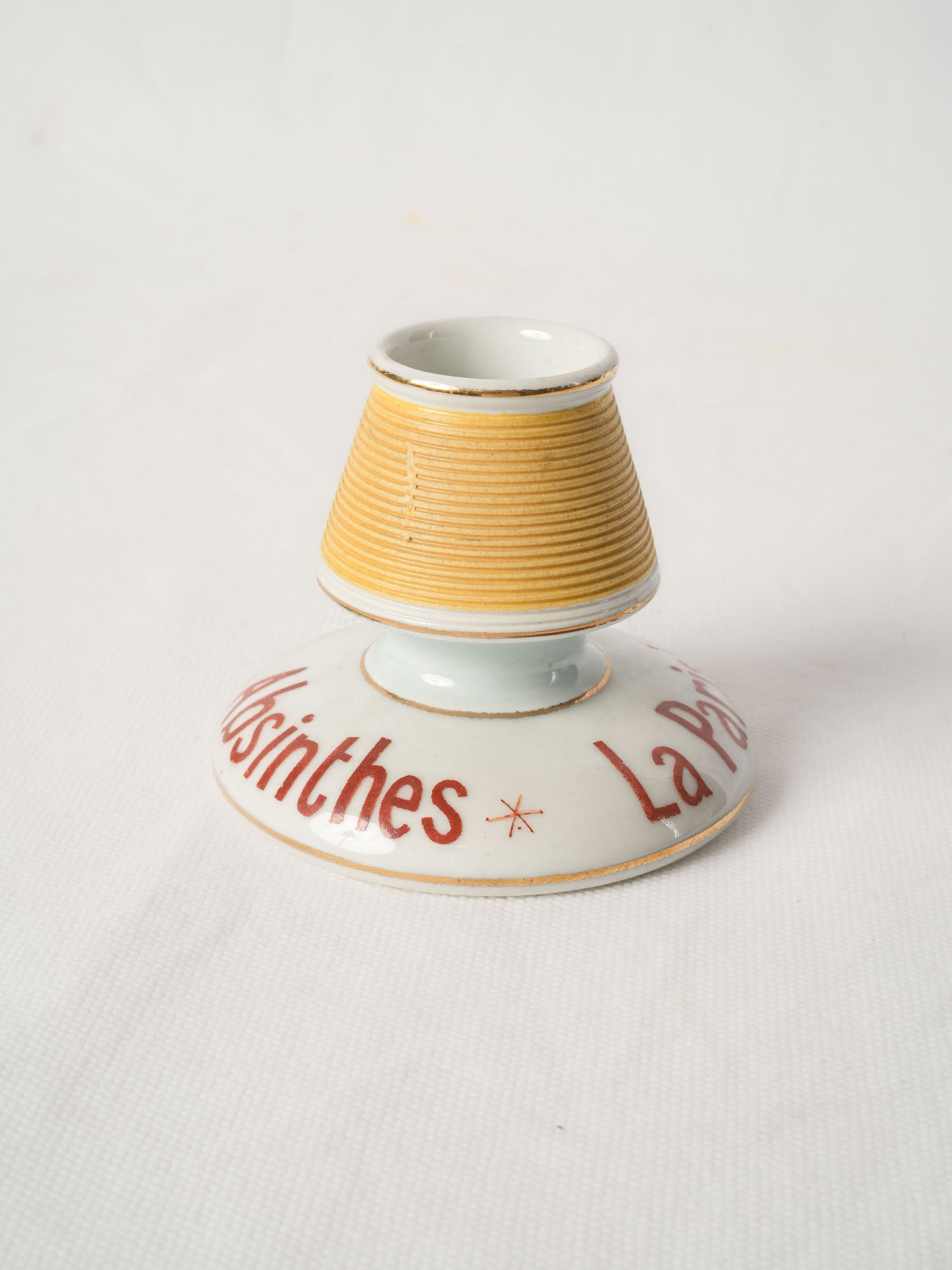 Straw-yellow gilt-edged porcelain striker