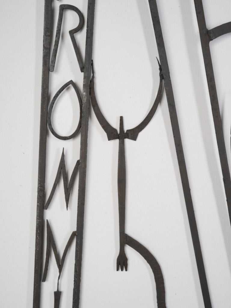 Rustic dark iron French sign