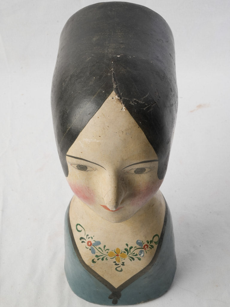 Inky black-haired hat form