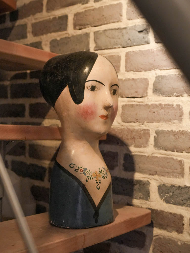 Seam-lined aged decorative head