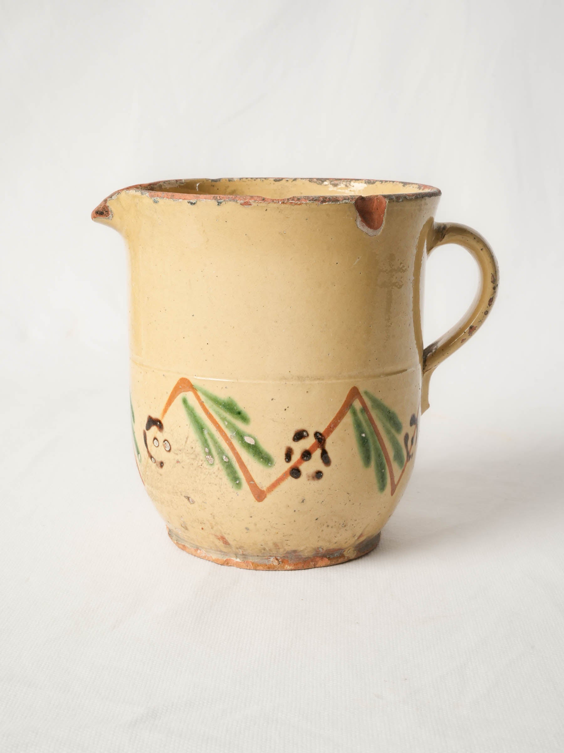 Elegant barbotine decorated pouring jug