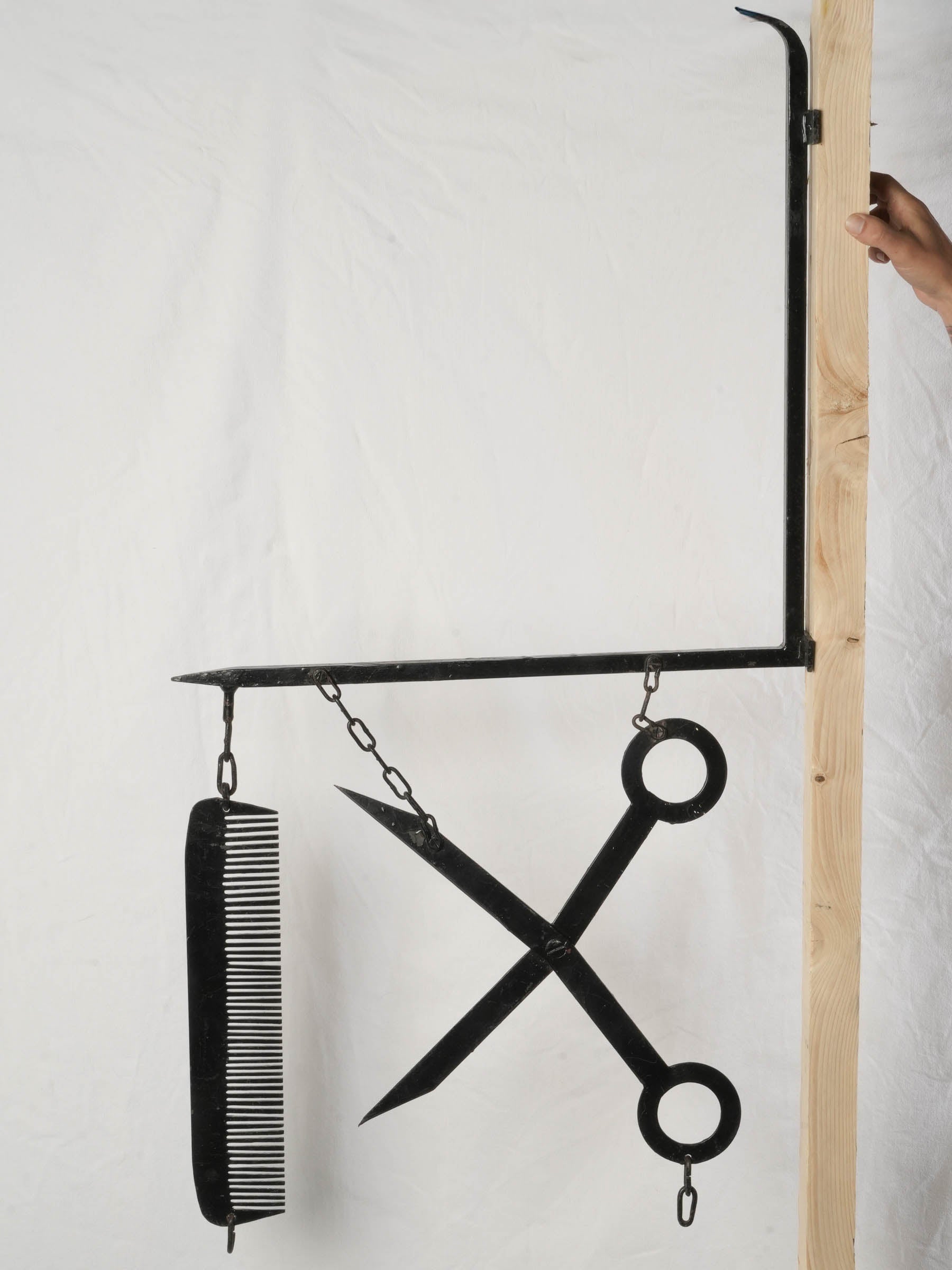 Hand-forged 1950s coiffeur trade sign