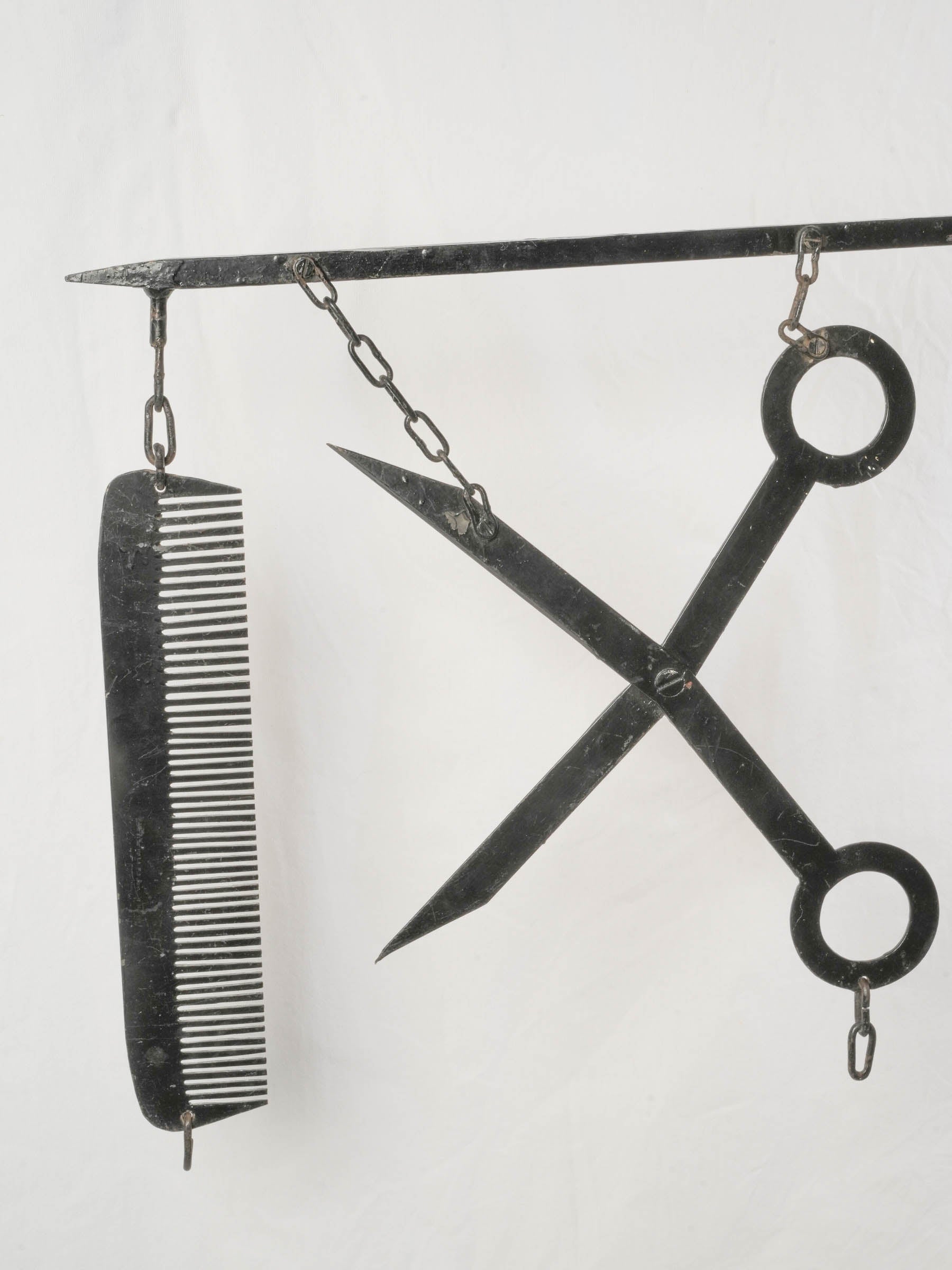 Industrial French scissors and comb sign