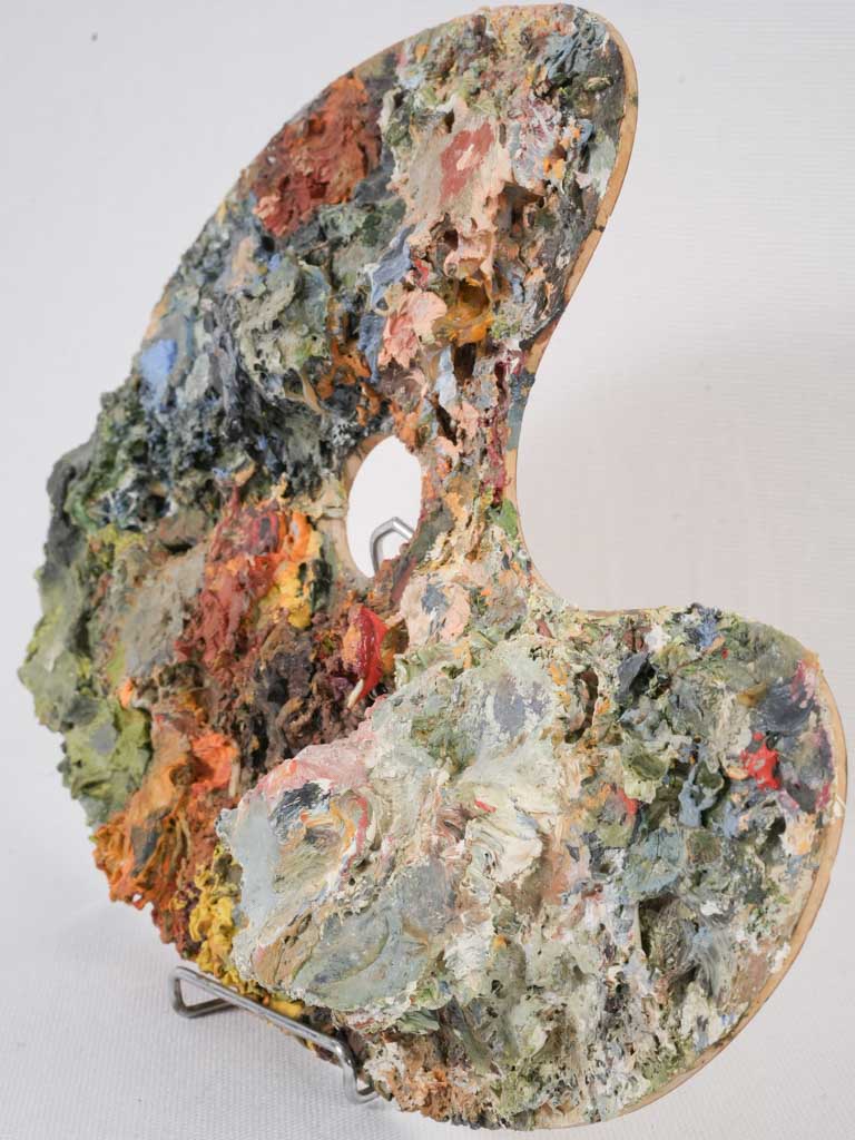 Wooden artist's paint palette in earthy tones