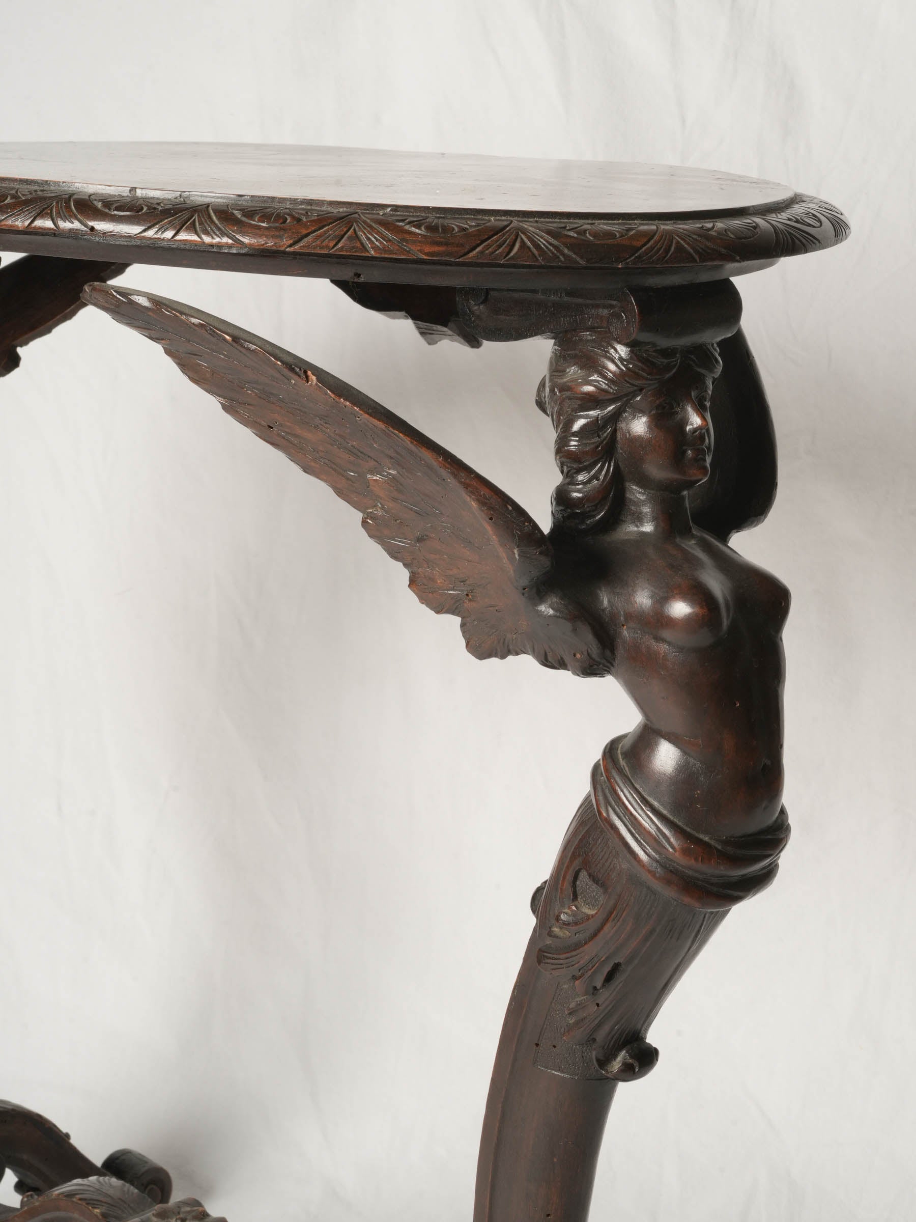 Napoléon III French beech oval side table w/ winged caryatids