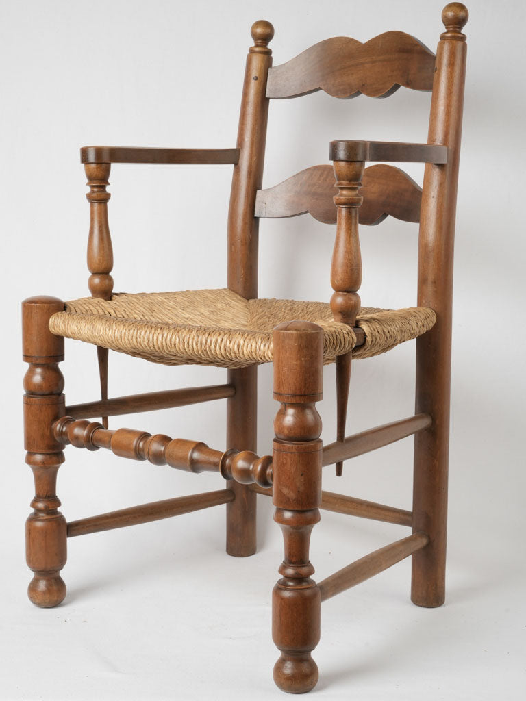 Aged French ladderback armchairs