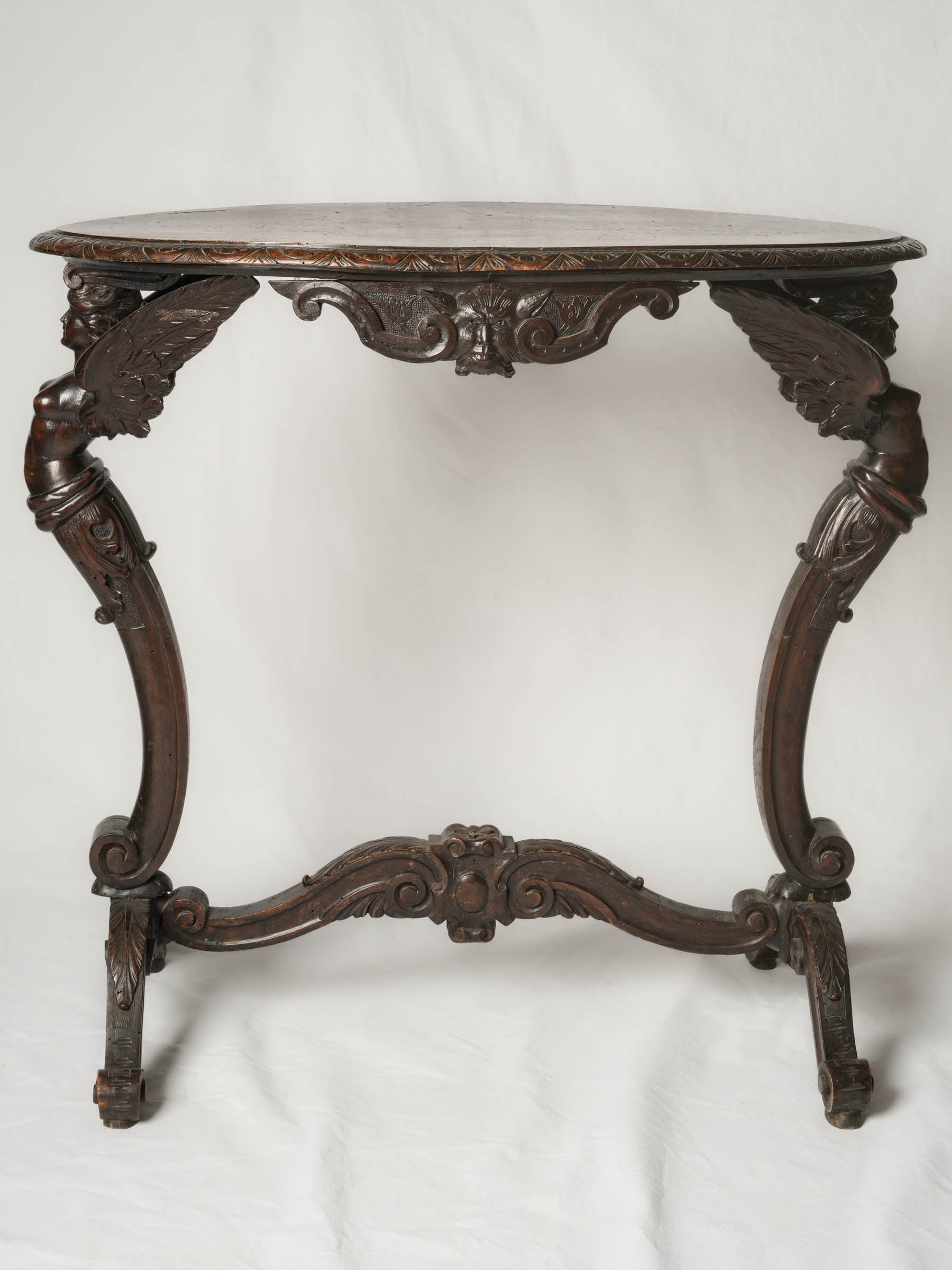 Napoléon III French beech oval side table w/ winged caryatids