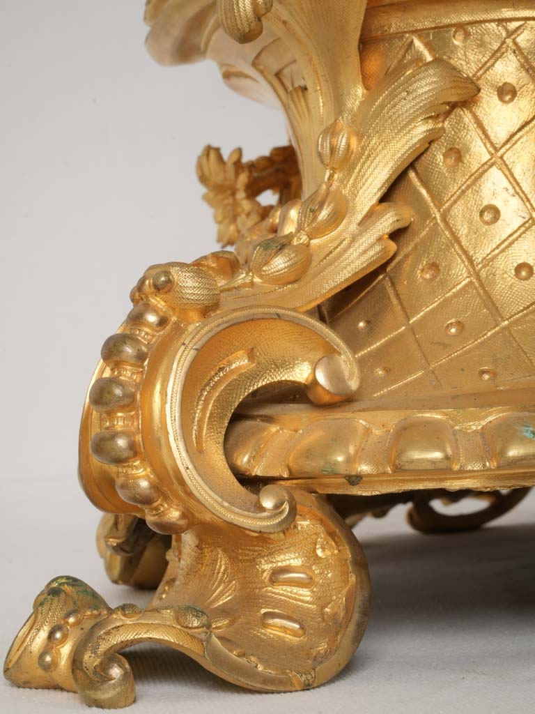 Whimsical cherub themed bronze clock garniture