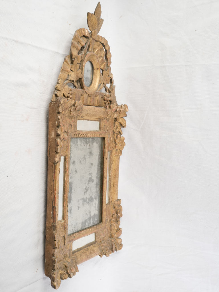 Giltwood sculptural crest antique mirror