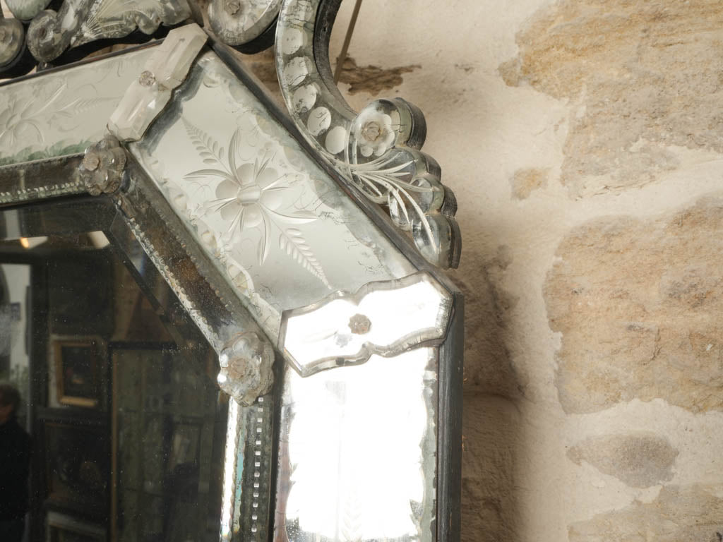 Elegant faceted rosette mirror