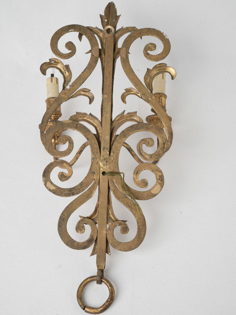 Richly detailed scrolling pattern sconces